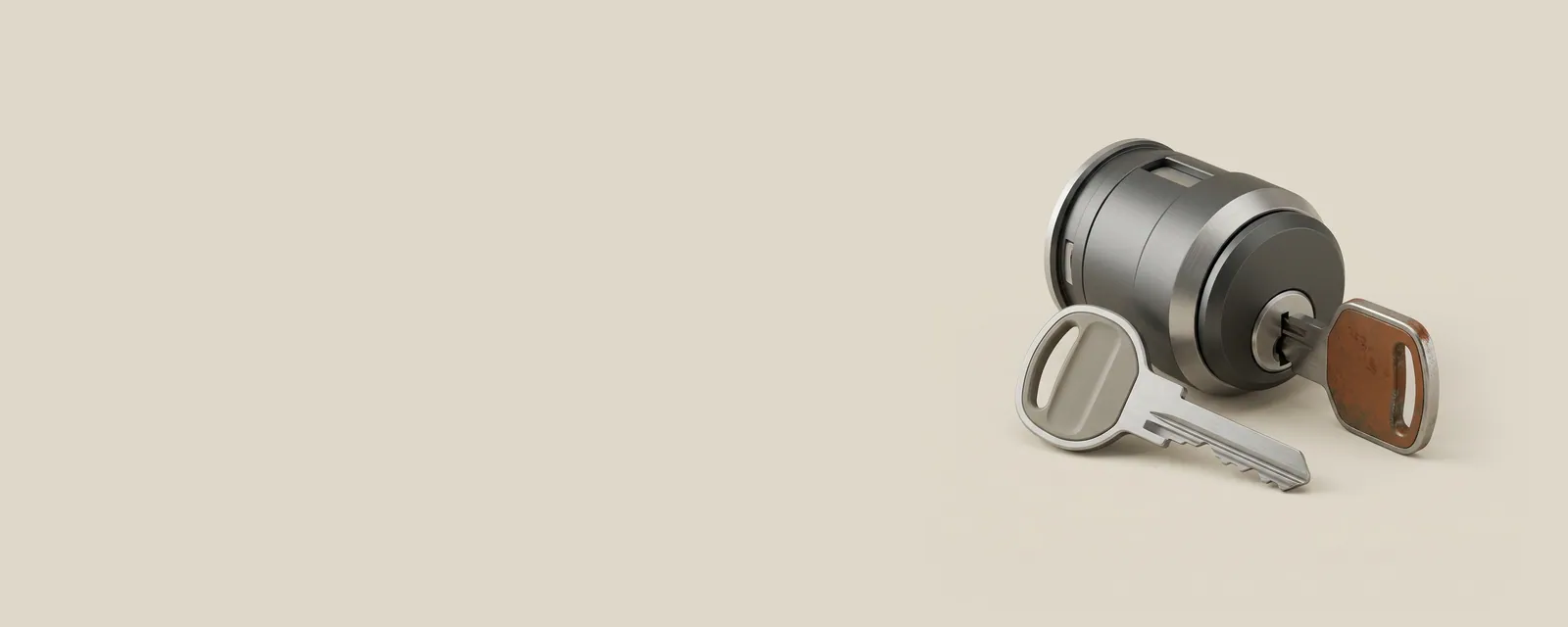 Studio render of two similar steel keys in different finishes both inserted into one precision lock cylinder