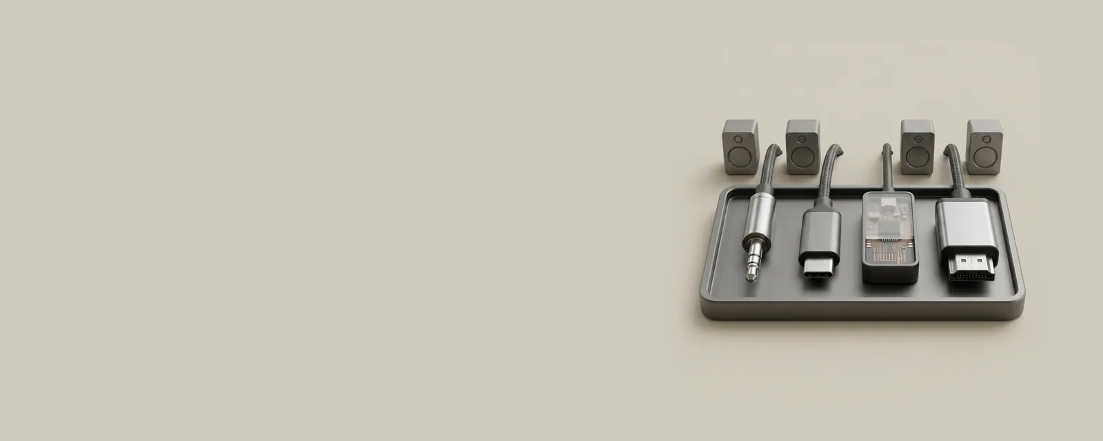 Studio render of a 3.5 mm jack, a USB-C plug, a Bluetooth dongle and an HDMI plug aligned on a machined tray, each cable leading to one speaker