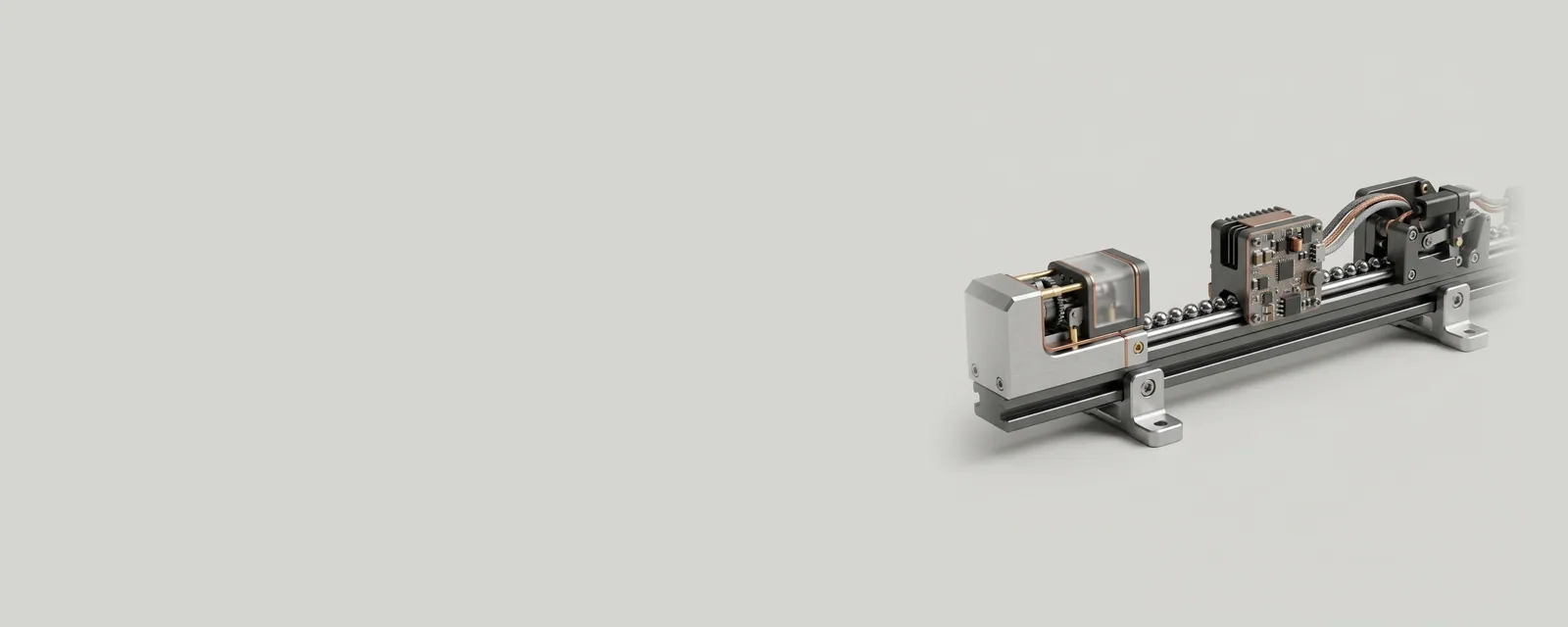 Studio render of a long machined rail with small device stations along it and steel beads travelling between them