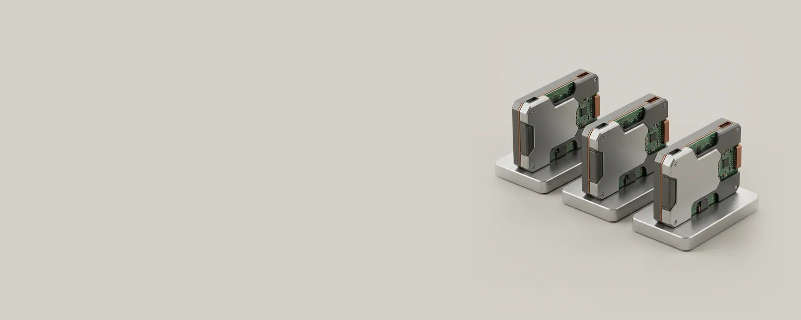 Studio render of three identical small devices each seated on its own machined aluminium base