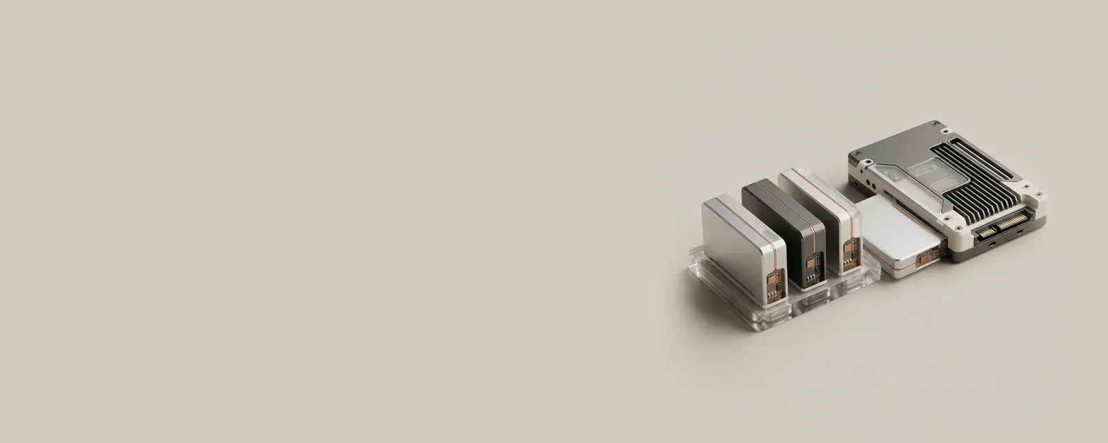 Studio render of a small acrylic tray holding machined blocks queued before an SSD, one block sliding into the drive