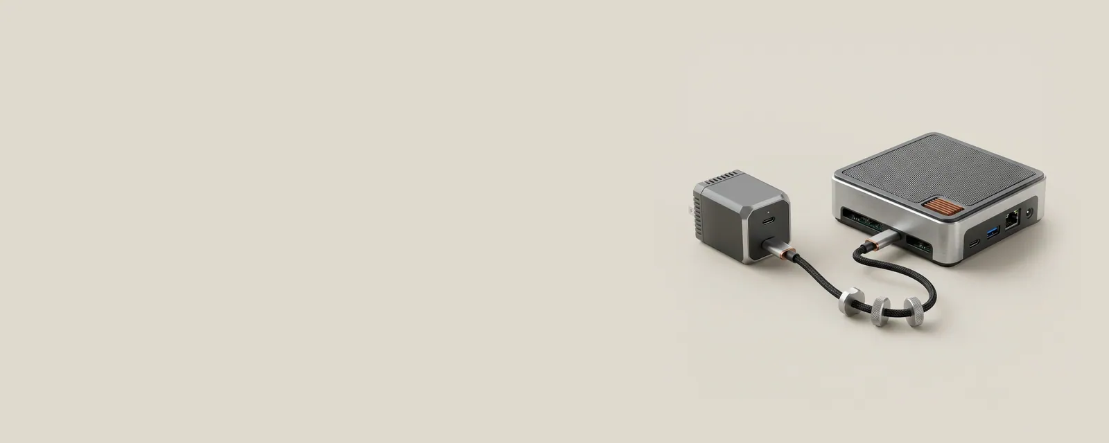 Studio render of a GaN charger and a small mini PC connected by a short USB-C cable with small machined negotiation tokens resting along it